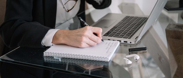 woman-making-notes-during-telework-at-home-JJA9B72.jpg